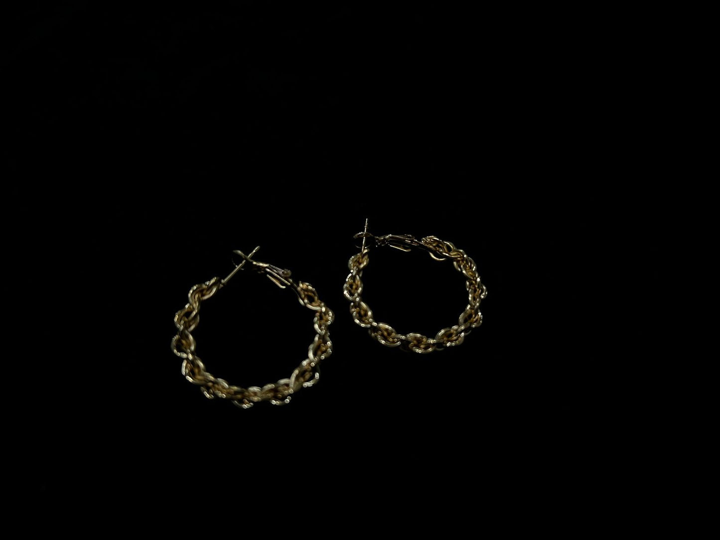 Twisted chain hoop earrings.